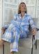 Warm women's pajamas made of flannel in a blue and grey cage, home clothes, S