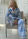 Warm women's pajamas made of flannel in a blue and grey cage, home clothes, L