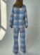 Warm women's pajamas made of flannel in a blue and grey cage, home clothes, S